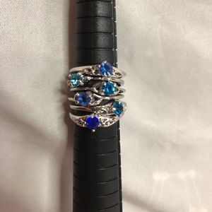 Pack of 6 silver rings with blue gems